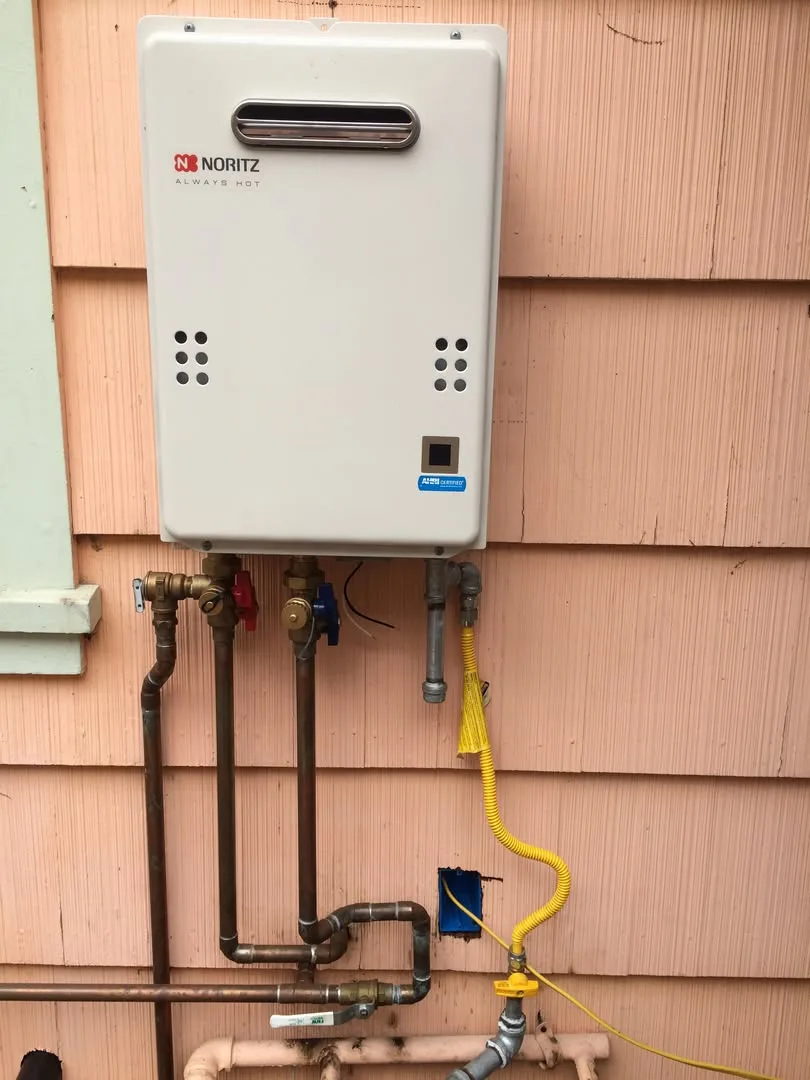 Exterior-mounted tankless water heater unit installed at a Chula Vista home