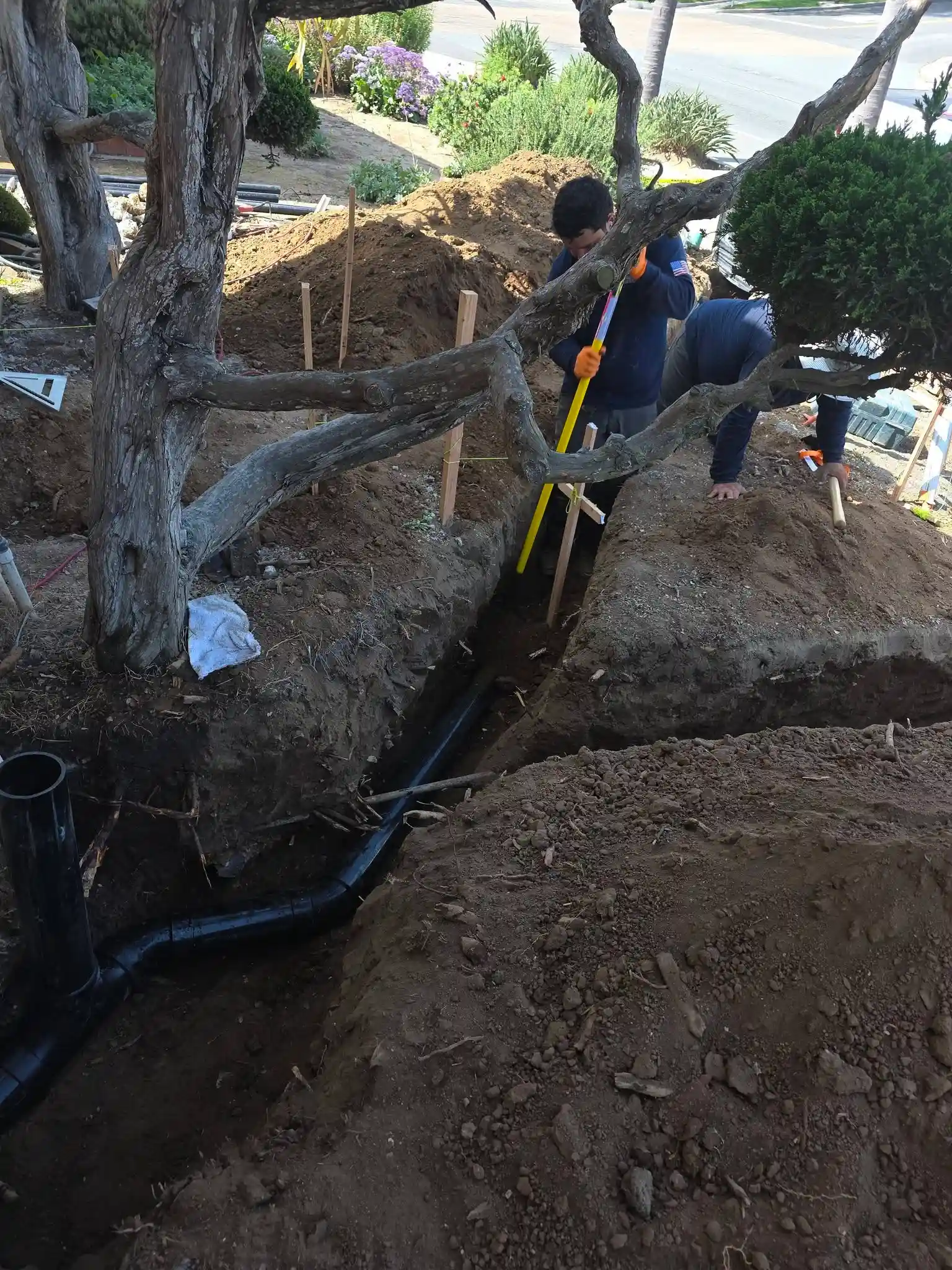 Plumbing technician repairing an underground pipe in Chula Vista