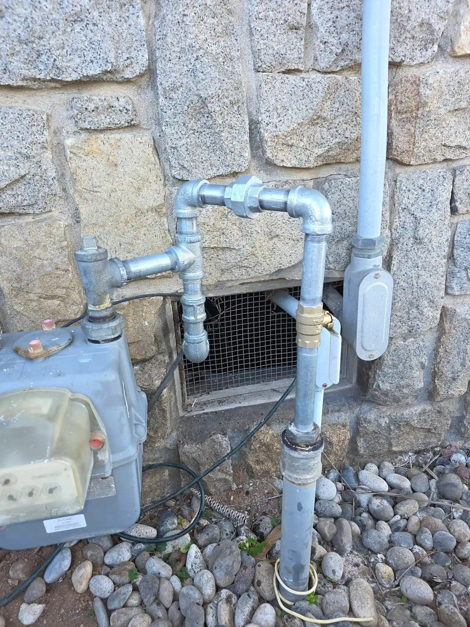 Water meter and pipe connections at a Chula Vista property